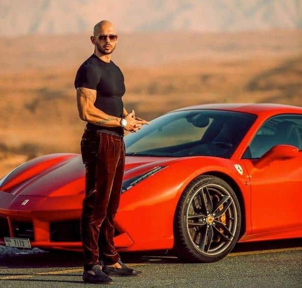 andrew tate with red car
