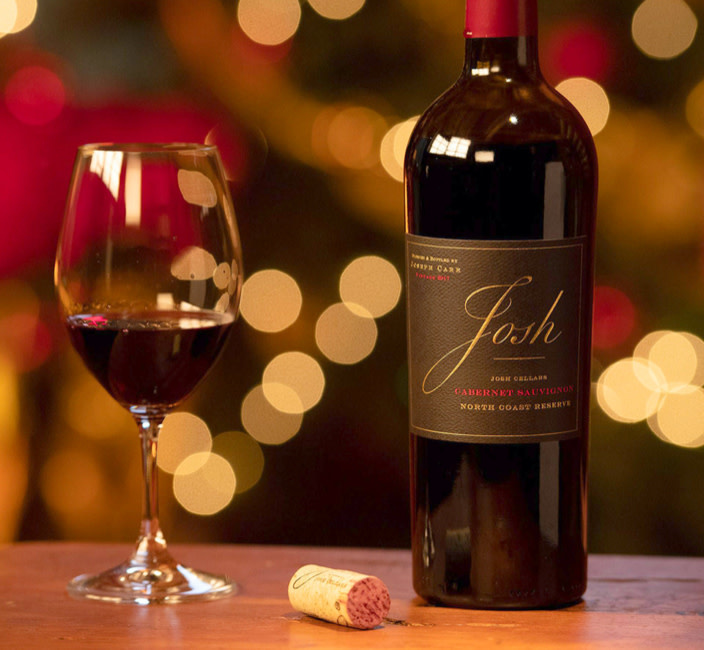 wine bottle on table with a glass of wine