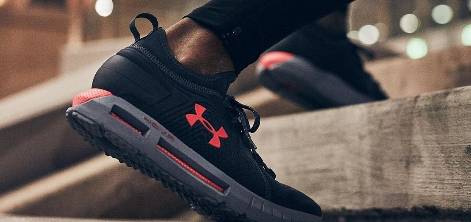 up close images of a black running shoe with Under Armour logo on the side