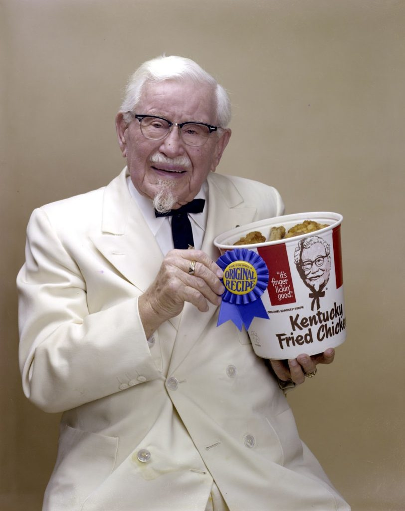 Old Man holding a bucket of chicken