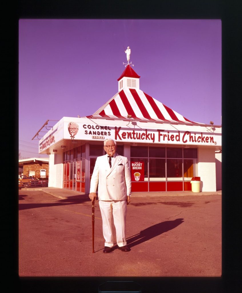 Man in front of fast food building