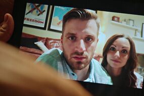 Selfie of a man and woman looking at a camera