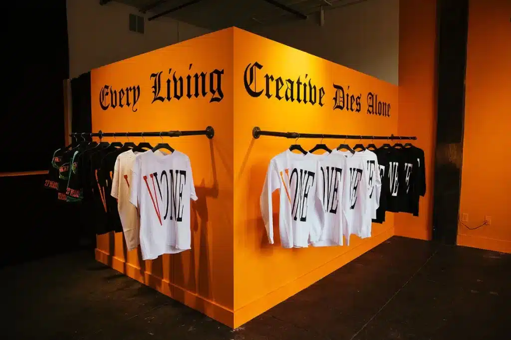 clothing hanging on an orange wall
