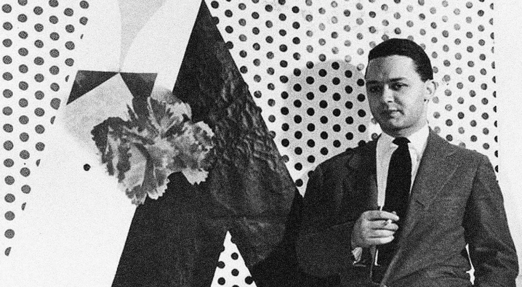 Black and white image of a man next to a sign