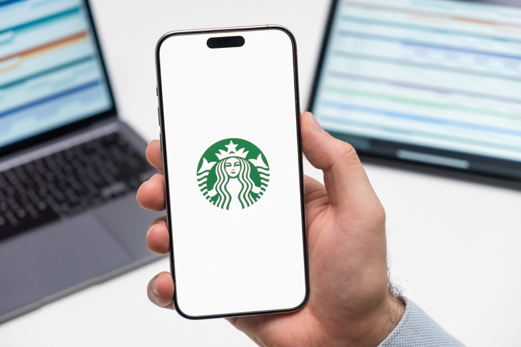 Starbucks mobile app on a phone in someone's hand